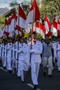 Group of students marching with Indonesian flag on National Independence Day in Yogyakarta, 17 August 2021