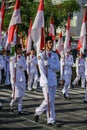 Group of students marching with Indonesian flag on National Independence Day in Yogyakarta, 17 August 2021