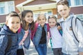 Students outside school standing together Royalty Free Stock Photo
