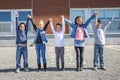 Students outside school standing together Royalty Free Stock Photo