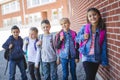 Students outside school standing together Royalty Free Stock Photo
