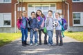 Students outside school standing together Royalty Free Stock Photo