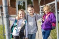 Students outside school standing together Royalty Free Stock Photo