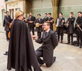 students playing musicand  play skits with touristsin on the street, Coimbra old city, Portugal Royalty Free Stock Photo