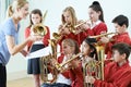 Group Of Students Playing In School Orchestra Together