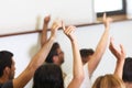 Group of students put hand up in class room Royalty Free Stock Photo