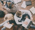 Group of students reading books, and studyin on the floor Royalty Free Stock Photo