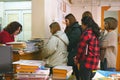 A group of students return books to the College library Royalty Free Stock Photo