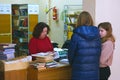 A group of students return books to the College library Royalty Free Stock Photo