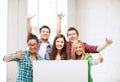 Group of students at school with blank board Royalty Free Stock Photo