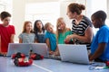 Group Of Students In After School Computer Coding Class Learning To Program Robot Vehicle Royalty Free Stock Photo