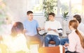 Group of students sitting in circle studying together in study hall of university Royalty Free Stock Photo