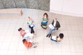 Group of students sitting down with lecturer