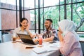 group of students smiling happily while working together Royalty Free Stock Photo