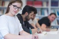 Group of students study together in classroom