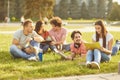 A group of students studying books sitting in a city park. Royalty Free Stock Photo