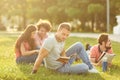 A group of students studying books sitting in a city park. Royalty Free Stock Photo