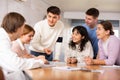 Group of students studying for difficult test in studygroup together Royalty Free Stock Photo