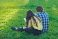 Group of students studying together on the green lawn