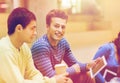 Group of students with tablet pc and coffee cup