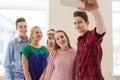Group of students taking selfie with smartphone Royalty Free Stock Photo