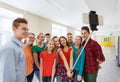 Group of students taking selfie with smartphone Royalty Free Stock Photo