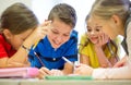 Group of students talking and writing at school Royalty Free Stock Photo