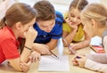 Group of students talking and writing at school Royalty Free Stock Photo