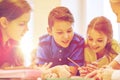 Group of students talking and writing at school Royalty Free Stock Photo