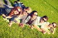 Group of students or teenagers lying in park