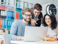 Group of students using a 3D printer and a laptop Royalty Free Stock Photo