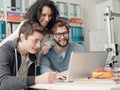 Group of students using a 3D printer and a laptop Royalty Free Stock Photo