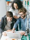 Group of students using a 3D printer and a laptop Royalty Free Stock Photo