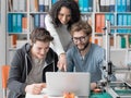 Group of students using a 3D printer and a laptop Royalty Free Stock Photo