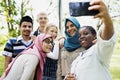 Group of students using mobile phone