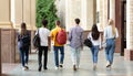 Group of students walking in college campus after classes Royalty Free Stock Photo