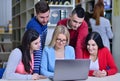 Group Of Students Working Together In Library With Teacher Royalty Free Stock Photo