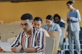 Group of students writing exam at university Royalty Free Stock Photo