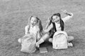 Group study outdoors girls classmates with backpacks, playful children concept