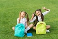 Group study outdoors girls classmates with backpacks, playful children concept