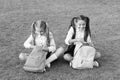 Group study outdoors girls classmates with backpacks, unpacking backpack concept