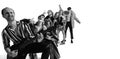 Group of stylish expressive people, man and woman, rock music performers posing over white background. Generation of 50s