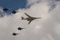 A group of SU-35S fighters and a Tu-160 supersonic long-range strategic bomber fly over Moscow`s Red Square during the dress rehea