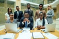 A group of successful afro americans, europeans ,arabic and korean businessman and businesswoman working in the office