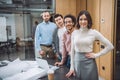 group of successful architects standing in row and looking at camera Royalty Free Stock Photo