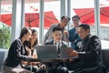 Group of successful business people cooperate discussing with his colleagues in coffee lounge