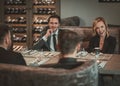 Group of successful business people discussing during business dinner in restaurant Royalty Free Stock Photo