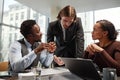 Group of successful business people discussing work over table in office Royalty Free Stock Photo