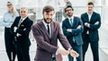 Group of successful business people standing in the office. Royalty Free Stock Photo