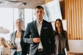 Group of successful business people standing together at office. Royalty Free Stock Photo